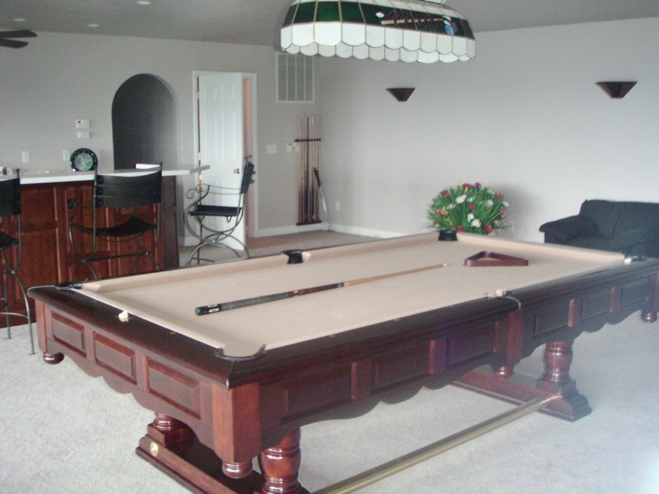 very large family room  with bar ample space for pool table and other games,  fireplace