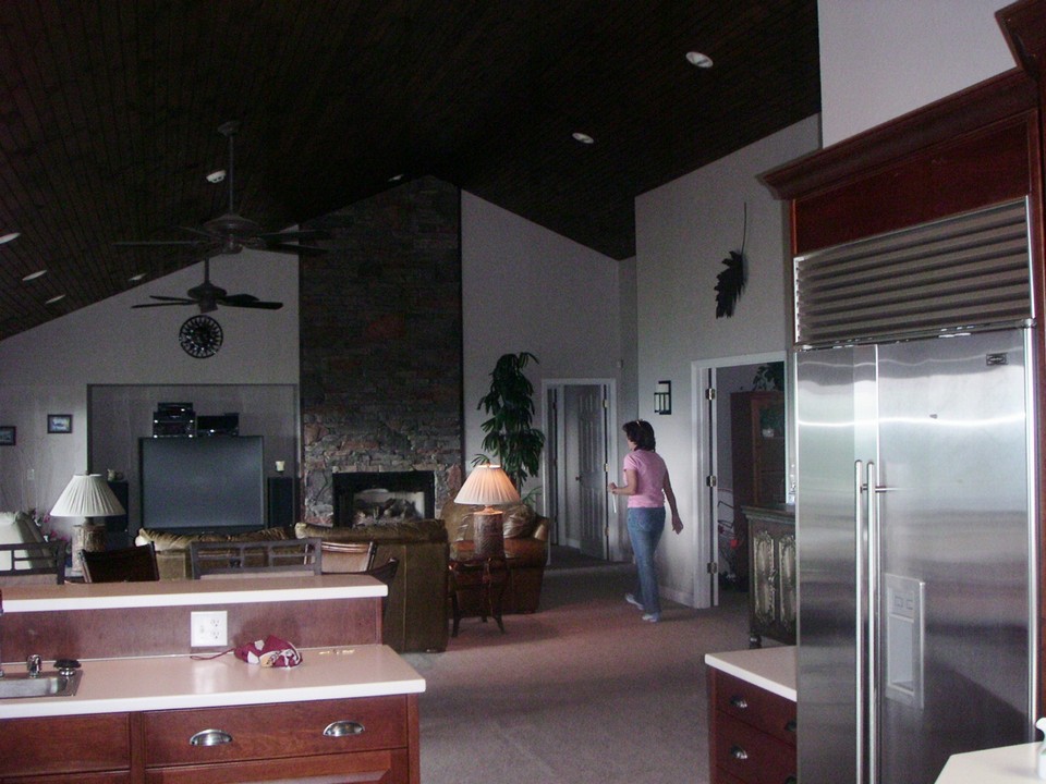 kitchen with sub zero refrigerator, breakfast bar,open to living room